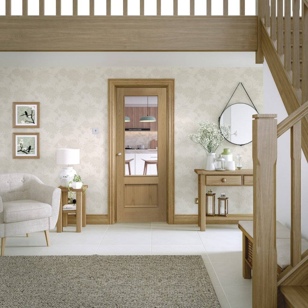 Modern interior design of a living room with wooden door, staircase, and decor elements.