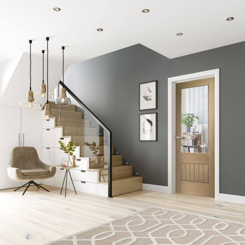 Modern interior design of a living room with gray walls, wooden staircase, and decorative elements.