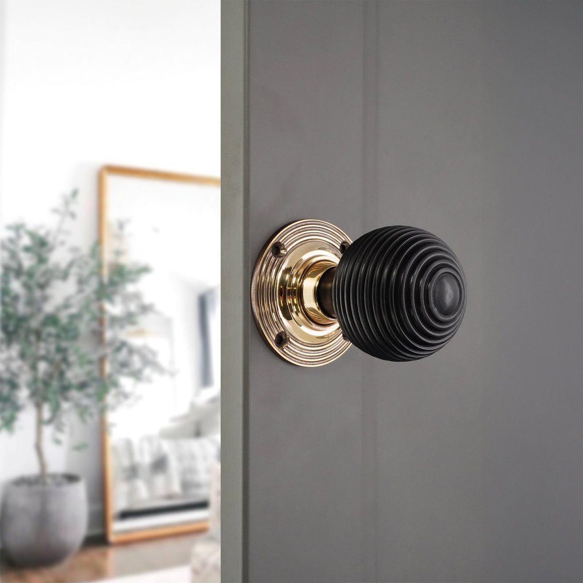 Ebony Beehive Rim/Mortice Door Knob Aged Brass